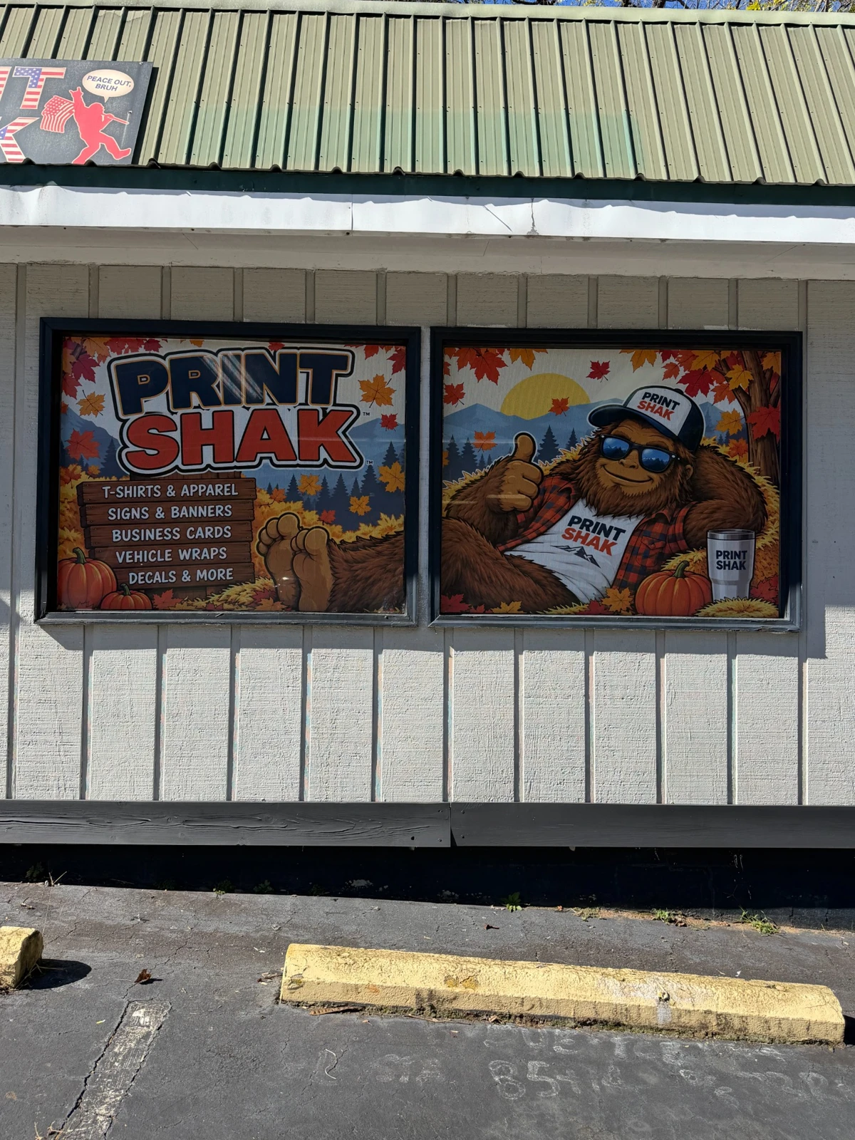 Fall Print Shak window graphics installed across two storefront windows