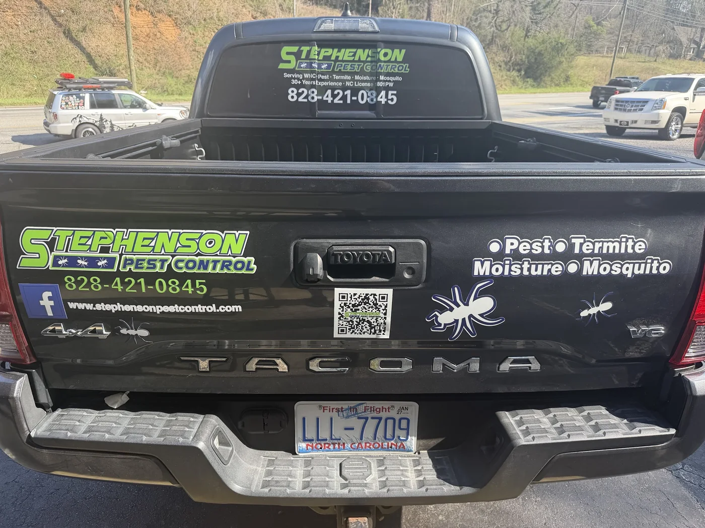 Stephenson Pest Control logo, contact details and QR code on pickup tailgate and rear window