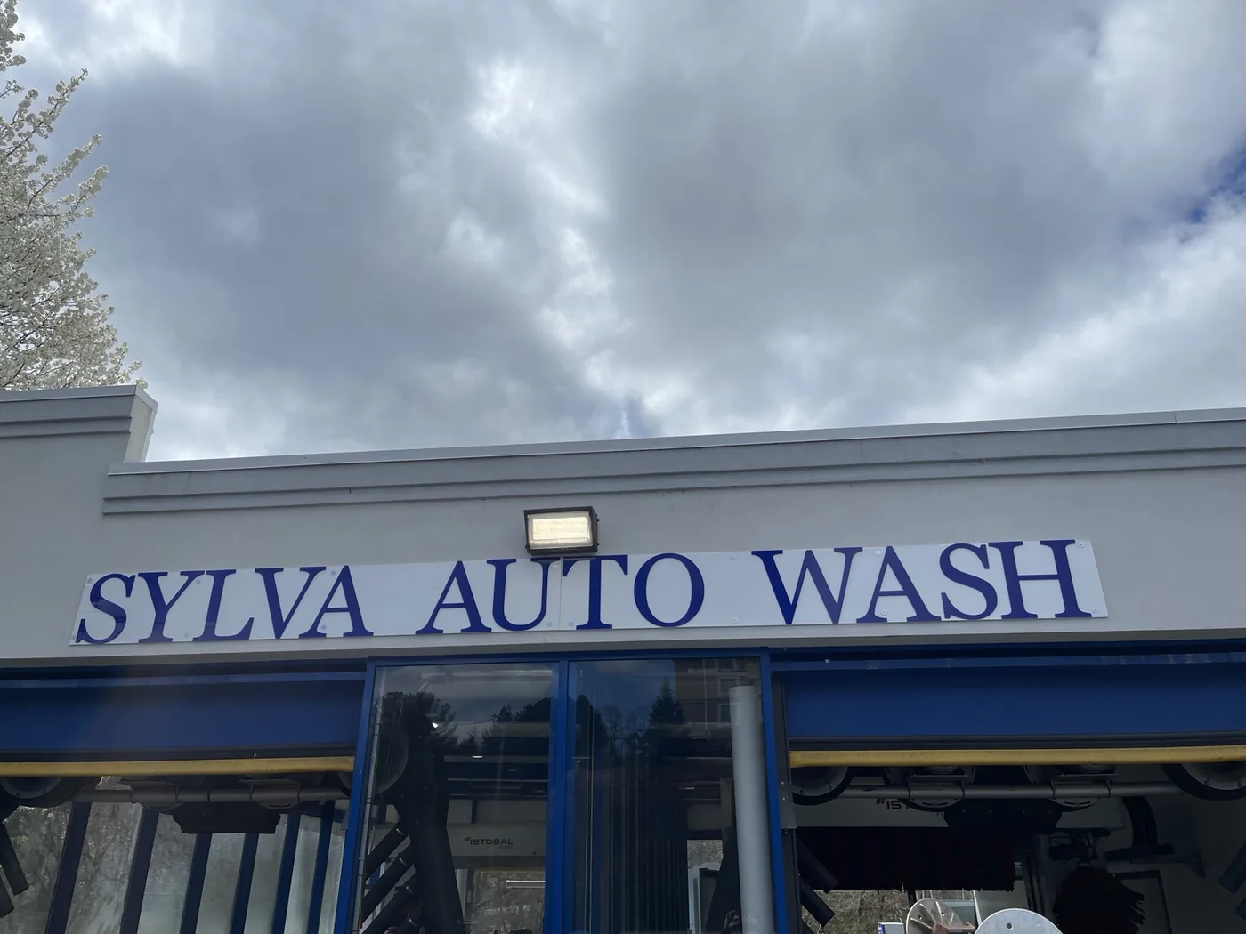 Sylva Auto Wash blue letters above the business entrance